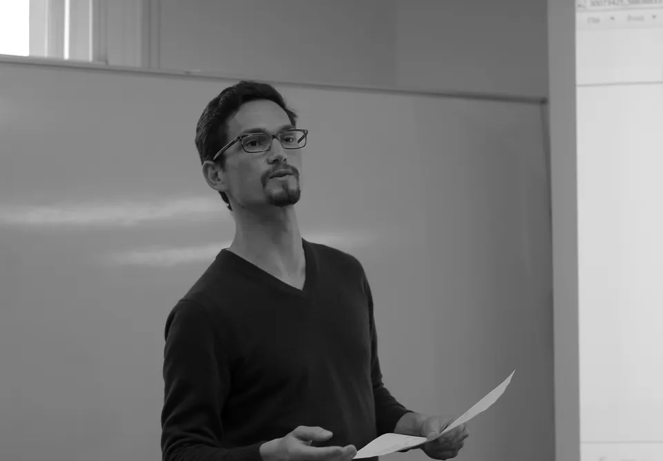 Benjamin Brast-McKie presenting at a whiteboard